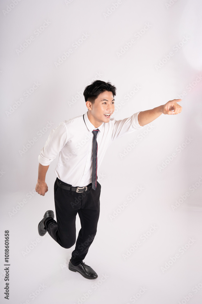 Full body of young Asian businessman posing on white background
Full body of young Asian businessman posing on white background