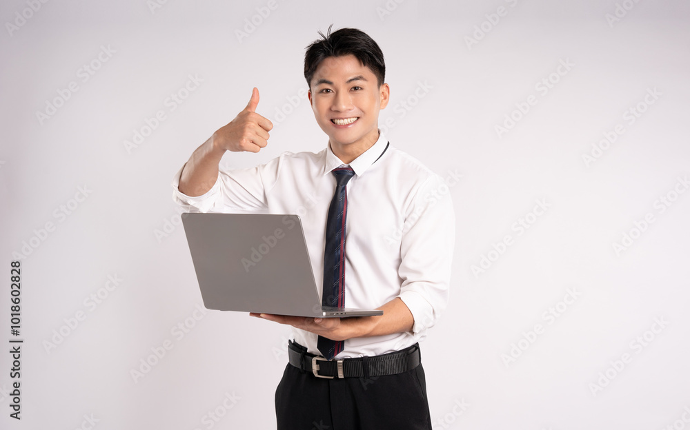 Portrait of Asian male businessman using laptop on white background Portrait of Asian male businessman using laptop on white background