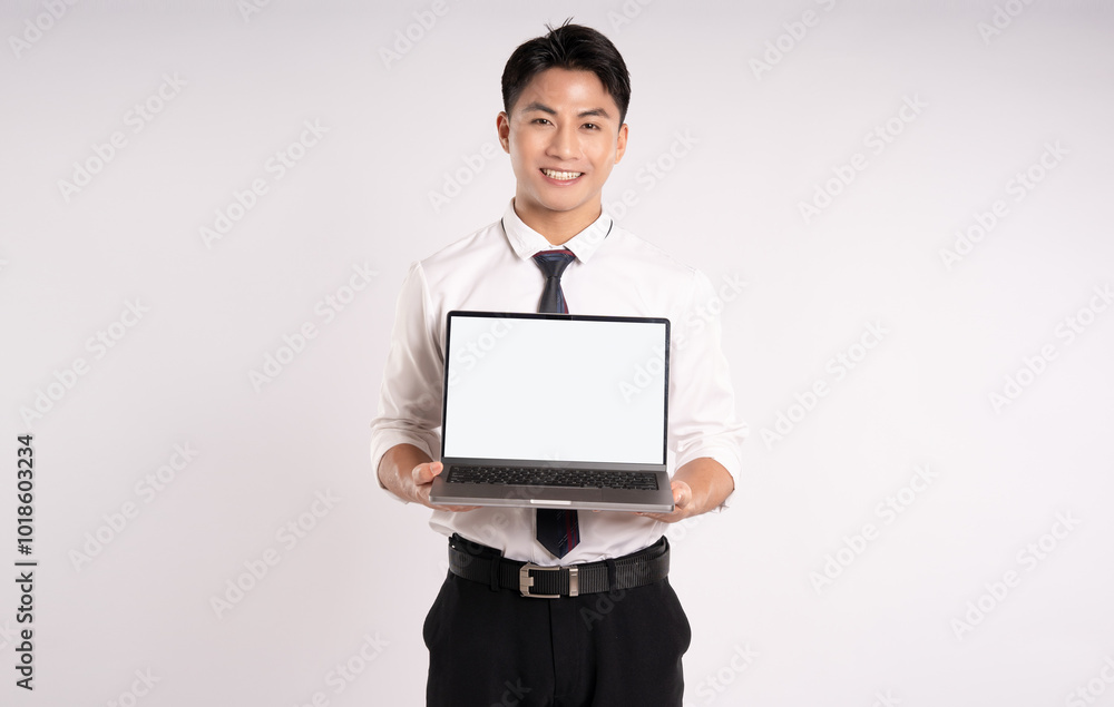 Portrait of Asian male businessman using laptop on white background Portrait of Asian male businessman using laptop on white background