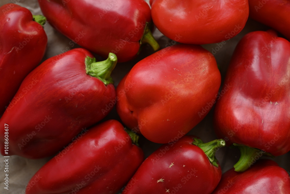 texture of red bell peppers as a background, autumn ripe juicy red bell peppers as a background, juicy organic food texture of red bell peppers as a background, autumn ripe juicy red bell peppers as a background, juicy organic food