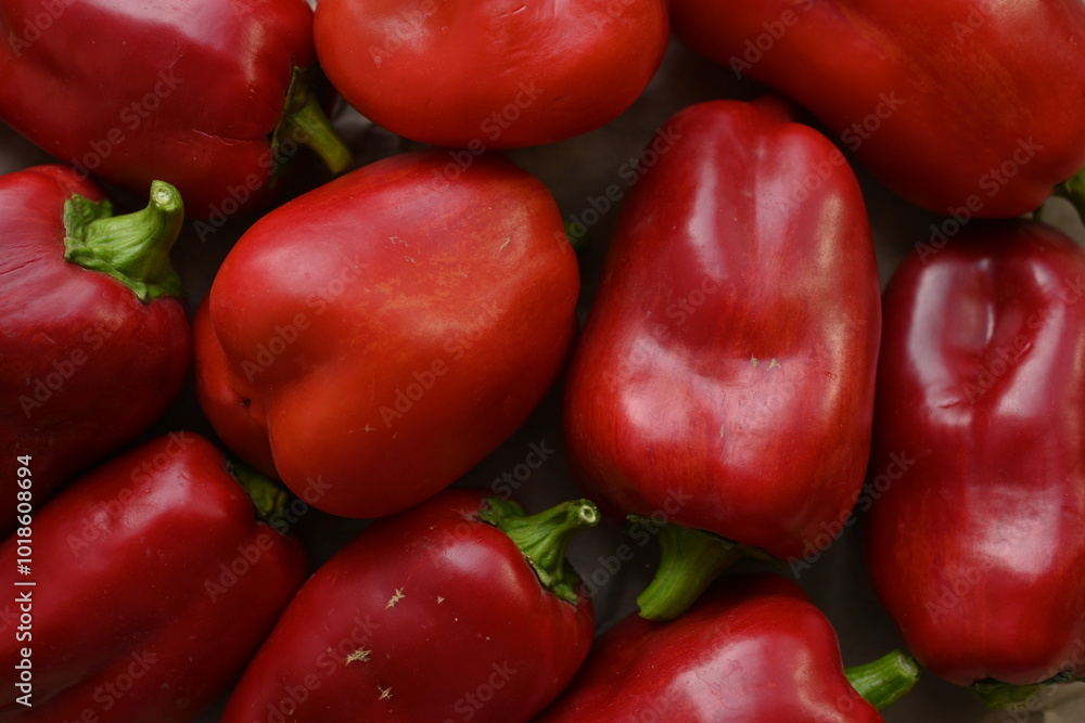 texture of red bell peppers as a background, autumn ripe juicy red bell peppers as a background, juicy organic food texture of red bell peppers as a background, autumn ripe juicy red bell peppers as a background, juicy organic food