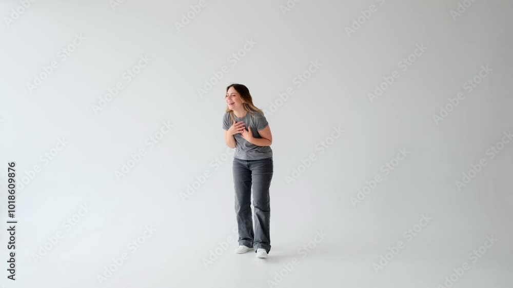 Happy Caucasian young adult woman laughing and having fun on white background. People with positive emotion. Enjoyment and pleasure concept. Happy Caucasian young adult woman laughing and having fun on white background. People with positive emotion. Enjoyment and pleasure concept.