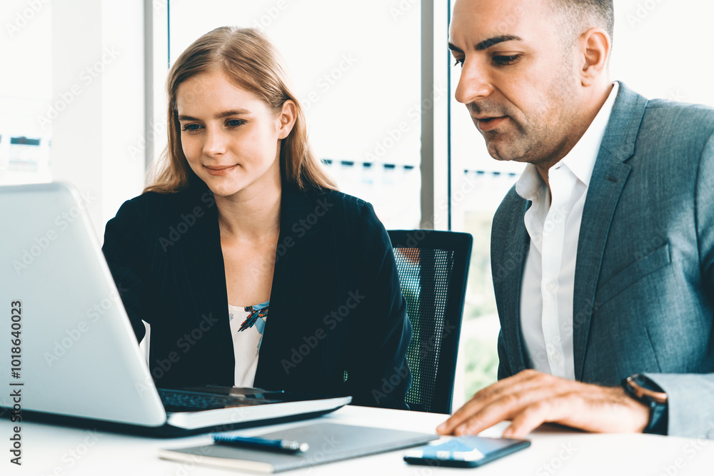 Businessman executive is in meeting discussion with a businesswoman worker in modern workplace office. People corporate business team concept. uds Businessman executive is in meeting discussion with a businesswoman worker in modern workplace office. People corporate business team concept. uds