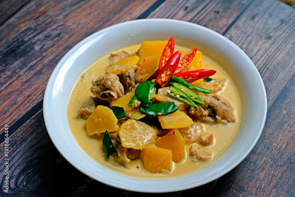 Authentic Thai red chicken curry with pumpkin.