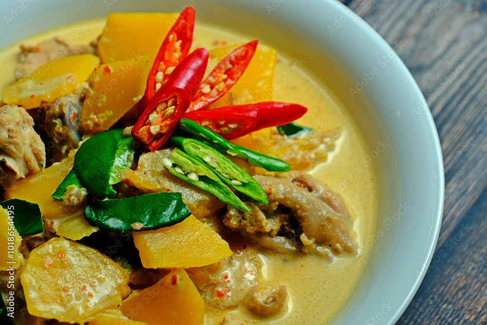 Authentic Thai red chicken curry with pumpkin.