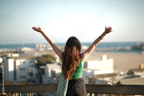 Young woman overlooking on hill overlooking Santa Monica Beach