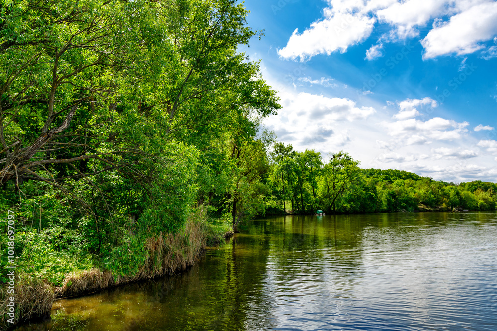 Carpfishing session at the Lake.Carp Angling scenic landscape overlooking lake at and blue sky with clouds.Fishing adventures, carp fishing. Carpfishing session at the Lake.Carp Angling scenic landscape overlooking lake at and blue sky with clouds.Fishing adventures, carp fishing.