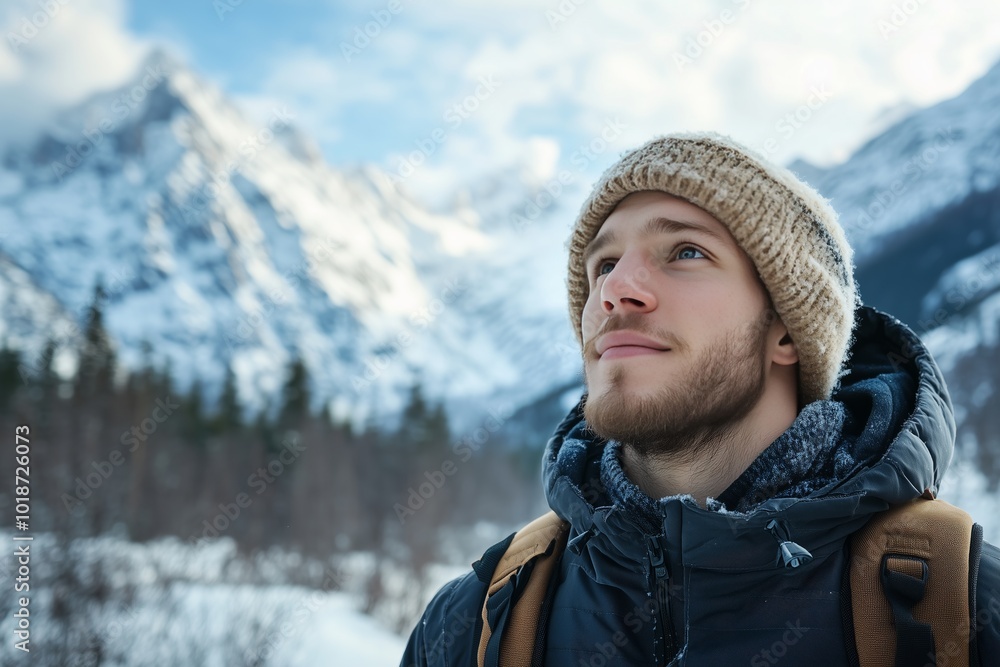 Portrait of a young man in his 20s enjoying a winter outdoor trip to the mountains with caucasian male in front a snowy mountain Portrait of a young man in his 20s enjoying a winter outdoor trip to the mountains with caucasian male in front a snowy mountain