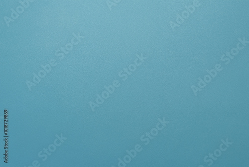 Simple minimalist blue textured background with a smooth surface, perfect for design projects.