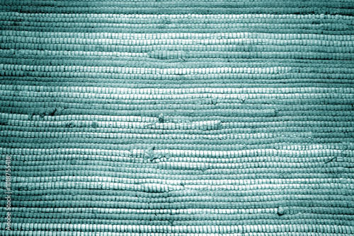 Cyan color handmade rag carpet or mat texture.