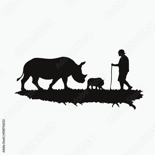 A silhouette of a person herding a rhinoceros in a grassy field 