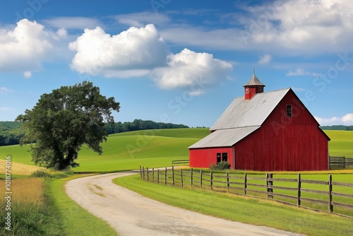 A red barn sits in a field with a dirt road leading to it. The barn is surrounded by a fence and there is a tree in the background. The scene is peaceful and serene, with the barn