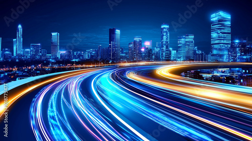 A highway with light trails curves through a modern city skyline at night.