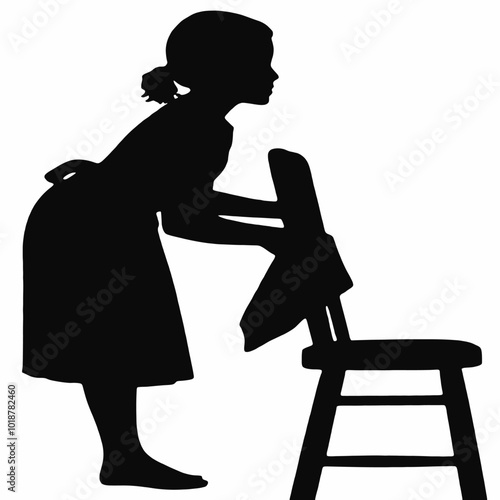 A young girl with short hair clinging on a chair, silhouetted against a plain background