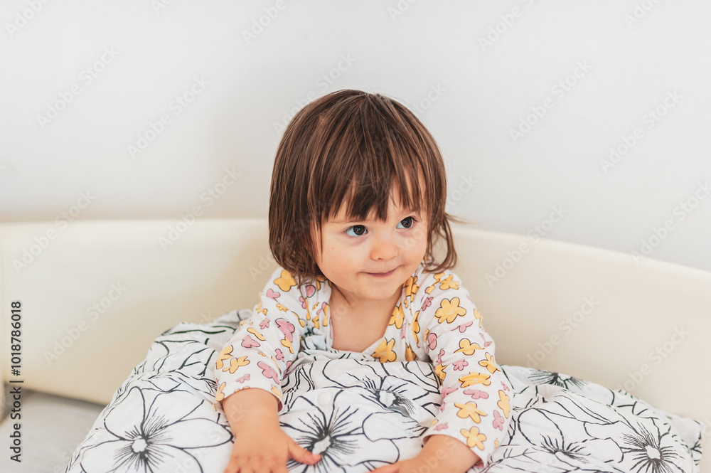 Pillow fight time, a little baby-girl loves playing with her pillow Pillow fight time, a little baby-girl loves playing with her pillow