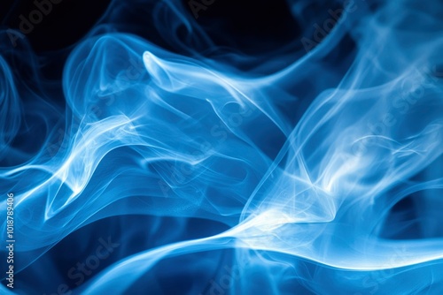 Abstract Blue Smoke Swirls Against a Black Background