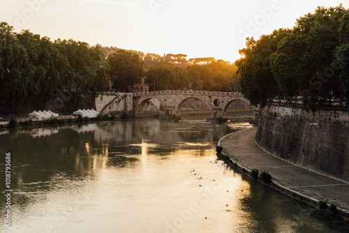 View of the Tiber river at sunset in Rome