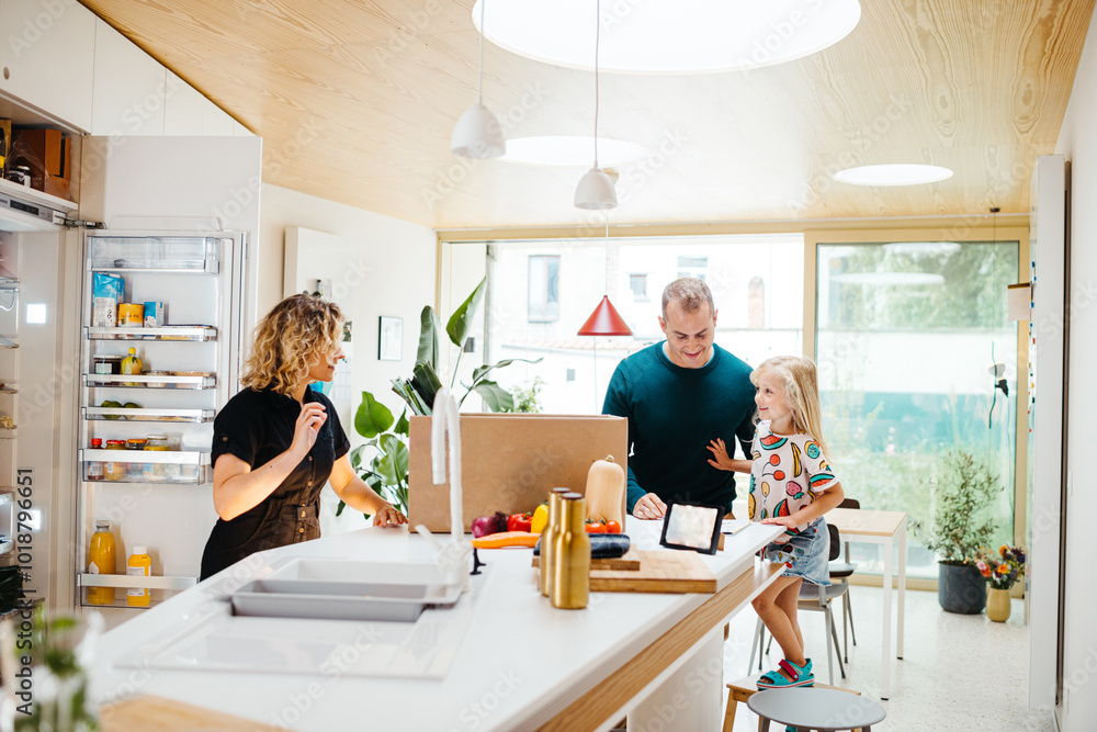 Family unpacking home delivery with groceries Family unpacking home delivery with groceries