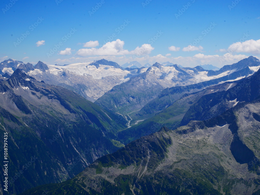 View on jagged mountains and glaciers of Zillertal alps on a summer day View on jagged mountains and glaciers of Zillertal alps on a summer day