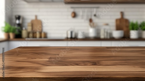 Wooden table top over blurred kitchen counter interior background, ready for product montage.