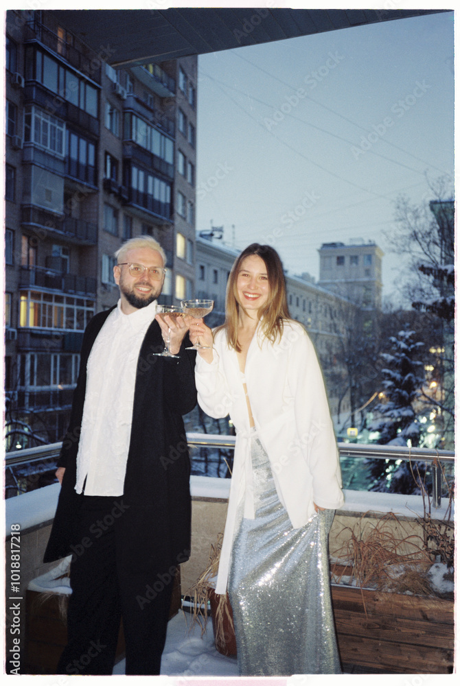 © Luciano Spinelli/Stocksy - Stylish young bride groom toasting in Moscow balcony © Luciano Spinelli/Stocksy - Stylish young bride groom toasting in Moscow balcony