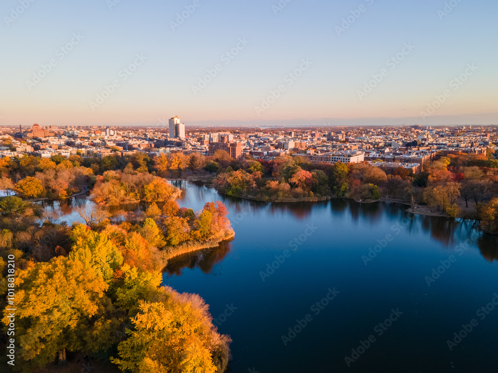 Aerial landscape of Prospect Park lake and Brooklyn Manhattan Skylines during fall in New York City Aerial landscape of Prospect Park lake and Brooklyn Manhattan Skylines during fall in New York City