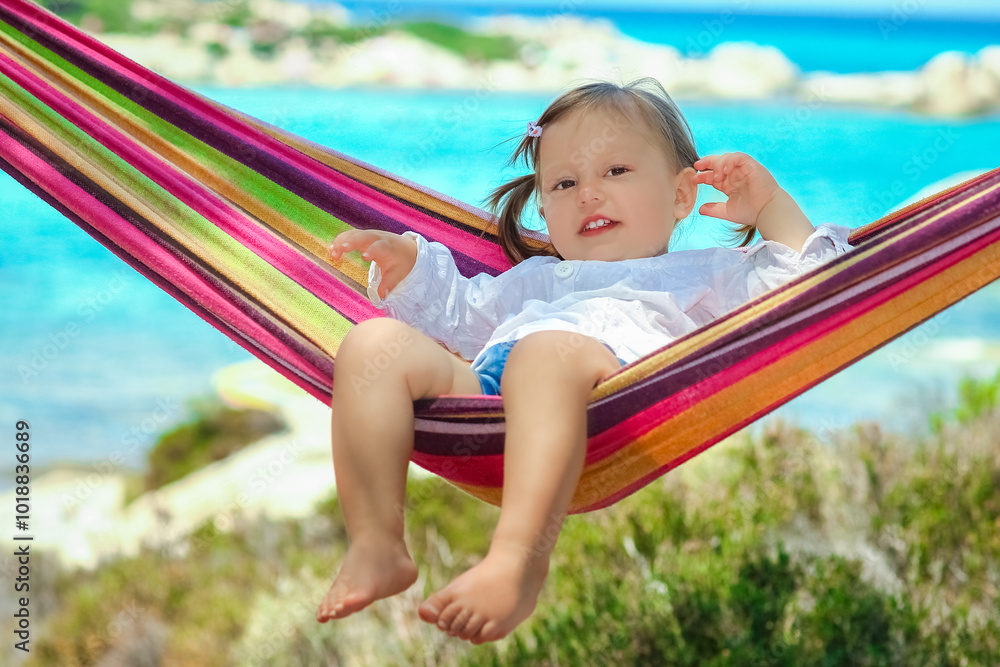 happy child by the sea on hammock in greece background happy child by the sea on hammock in greece background