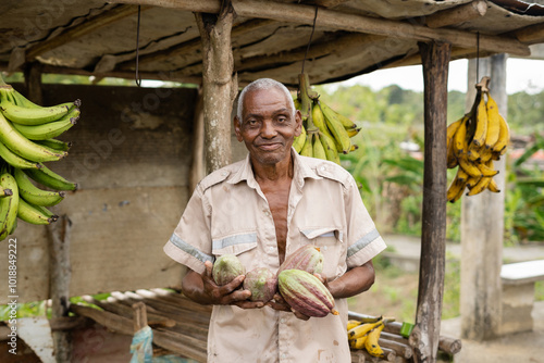 A happy farmer with cacao in his hands photo