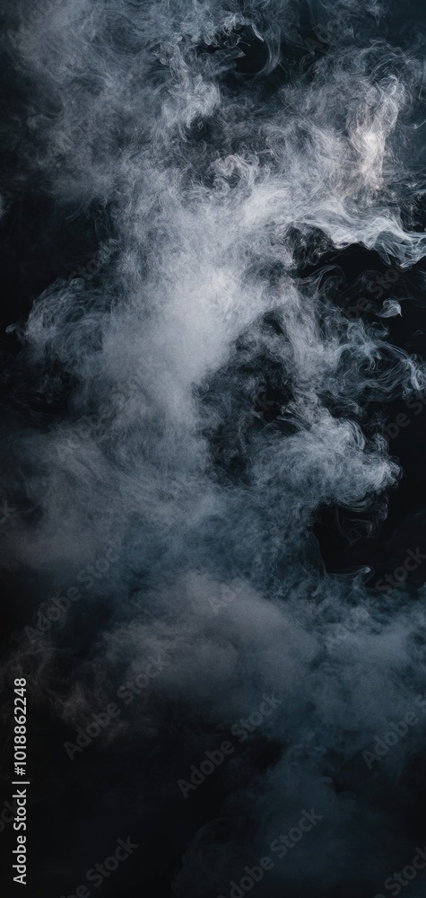 Fototapeta premium Mysterious wisps of smoke dance in dark shades of grey and silver against a deep black background, creating a cinematic ambience