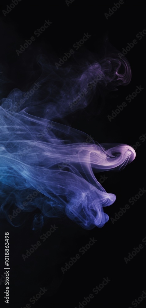 Fototapeta premium Delicate smoke trails in purple and blue tones swirl against a solid black background for a moody vertical wallpaper
