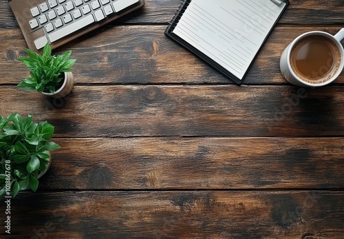 Cozy workspace with coffee cup, keyboard, and potted plant on rustic wooden t...