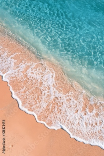 Tranquil beach setting with lounge chairs and umbrellas along a clear turquoi...