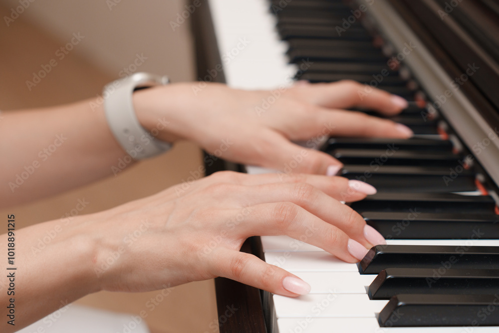 hands of young woman playing piano hands of young woman playing piano