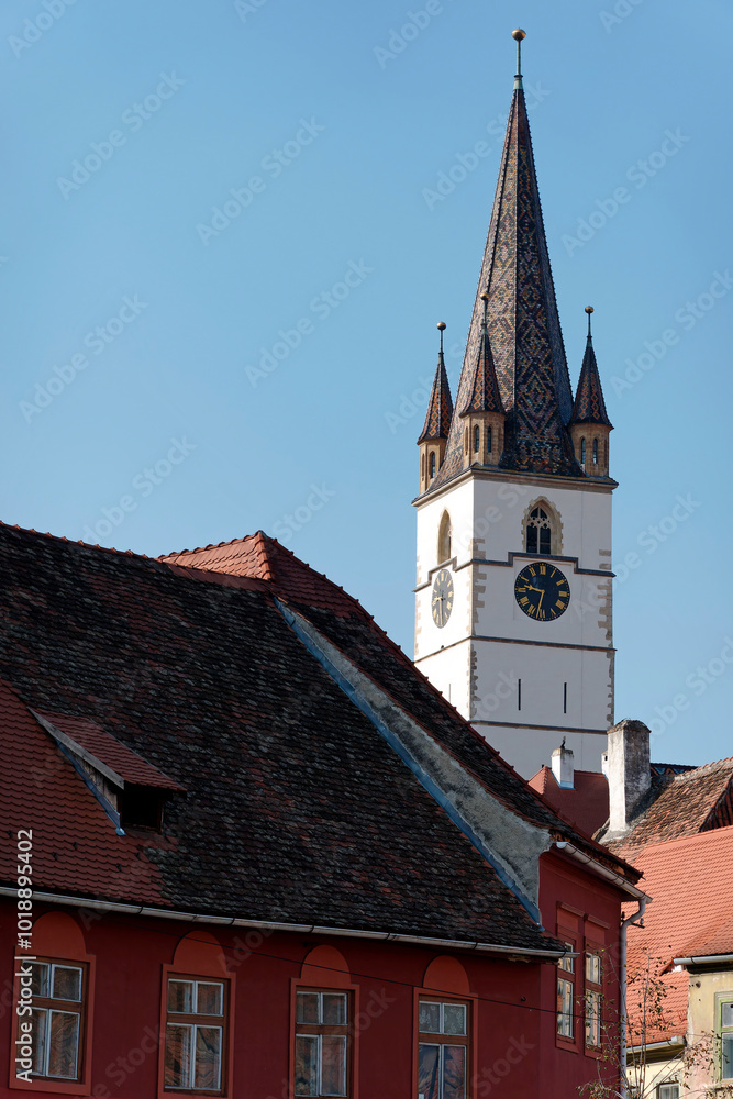 Fragment from the clock tower of Lutheran Cathedral of Saint Mary. It is a prominent landmark in Sibiu, Romania, one of the largest Gothic-style churches in Transylvania. Fragment from the clock tower of Lutheran Cathedral of Saint Mary. It is a prominent landmark in Sibiu, Romania, one of the largest Gothic-style churches in Transylvania.