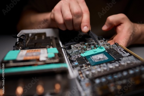 Hand Repairing a Graphics Card through the Application of Thermal Paste for Better Performance