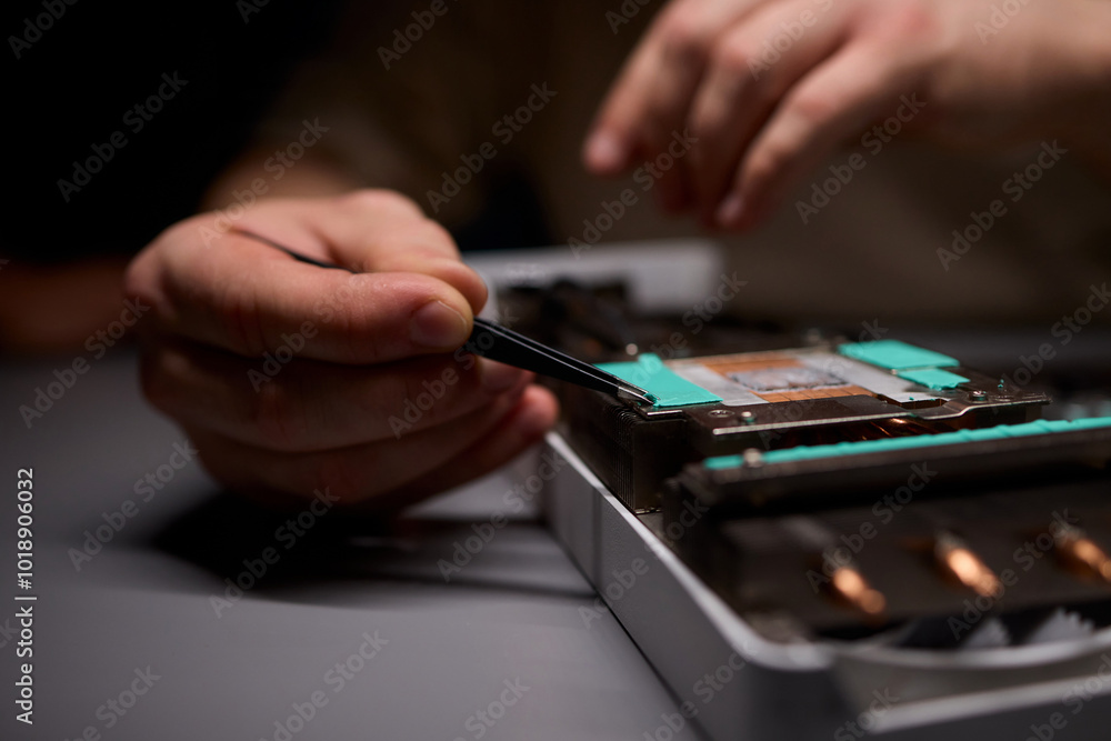 Hand Repairing a Graphics Card through the Application of Thermal Paste for Better Performance Hand Repairing a Graphics Card through the Application of Thermal Paste for Better Performance