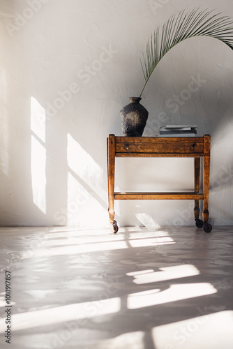 Sunlit textured interior with vintage table photo