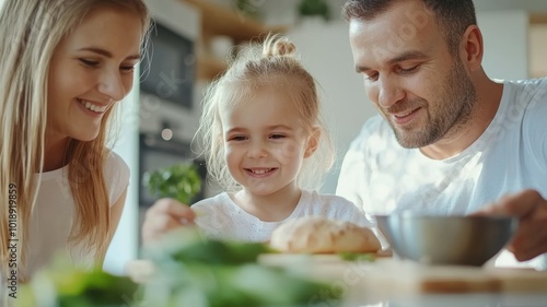 Family enjoying a meal together while preparing healthy food in a bright kitchen during the daytime