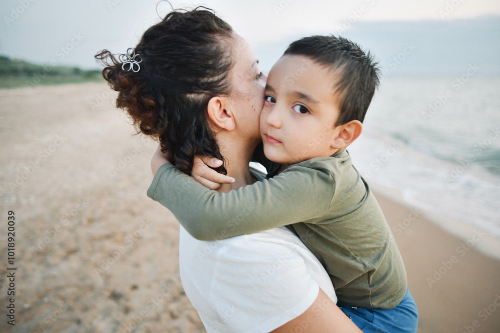 mother hugs her son on the seashore mother hugs her son on the seashore