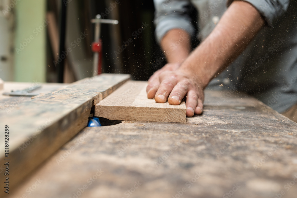 A carpenter is milling an oak plank A carpenter is milling an oak plank