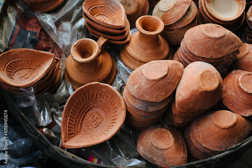 Clay pots and diyas displayed at a market stall in India