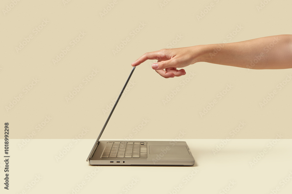 © Yaroslav Danylchenko/Stocksy - Person switching computer into sleeping mode while shutting down