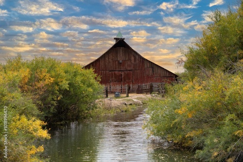 Red barn wiith reflection in pond near Burns Oregon photo