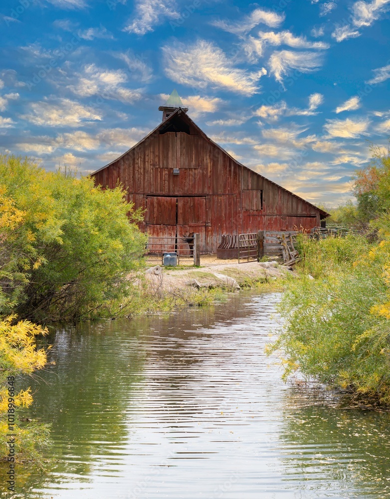 Red barn wiith reflection in pond near Burns Oregon Red barn wiith reflection in pond near Burns Oregon