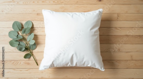 plain white square pillow on light brown wood floor