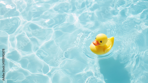 Yellow Rubber Duck Floating in Clear Blue Water. National Rubber Ducky Day.