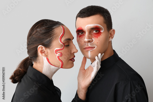 Young couple with painted f...