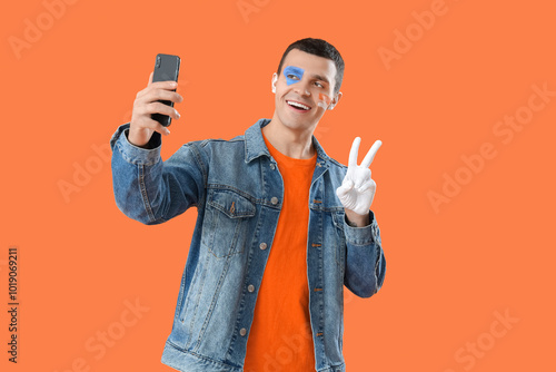 Young man with painted face...