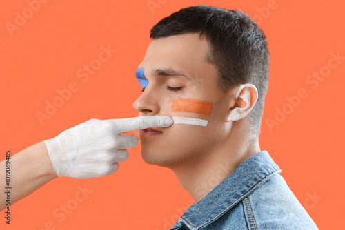 Young man with painted face...