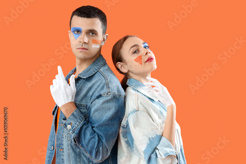 Young couple with painted f...
